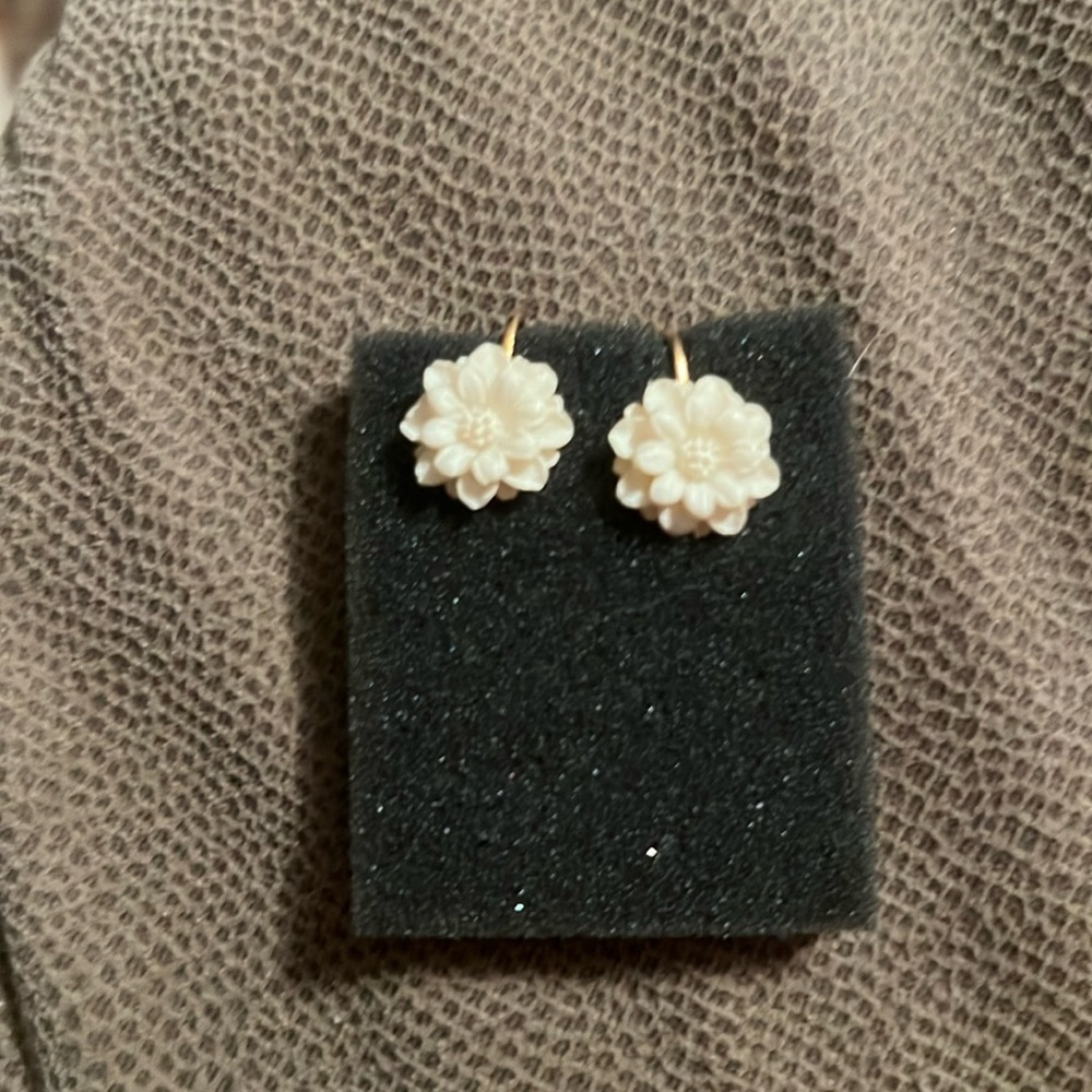 Beautiful with the look of ivory, clip on earrings that can be dressed up